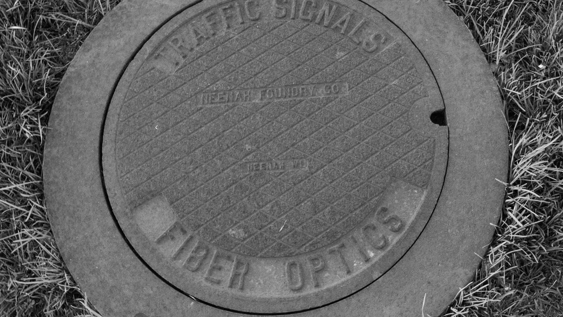 Traffic signals and fiber optics utility access cover — James H Drew Corporation traffic signal and fiber optic network infrastructure